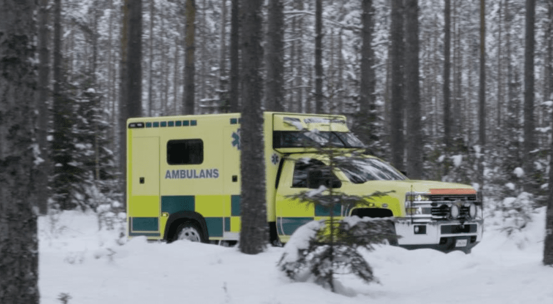 Ambulance in forest with lots of snow. Ambulans i skog med mycket snö.
